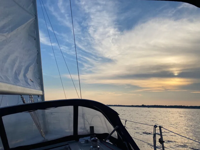 Slide: The Image of Sailing on a 1997 Catalina 28 MkII at sunset, with serene ocean views. - 5