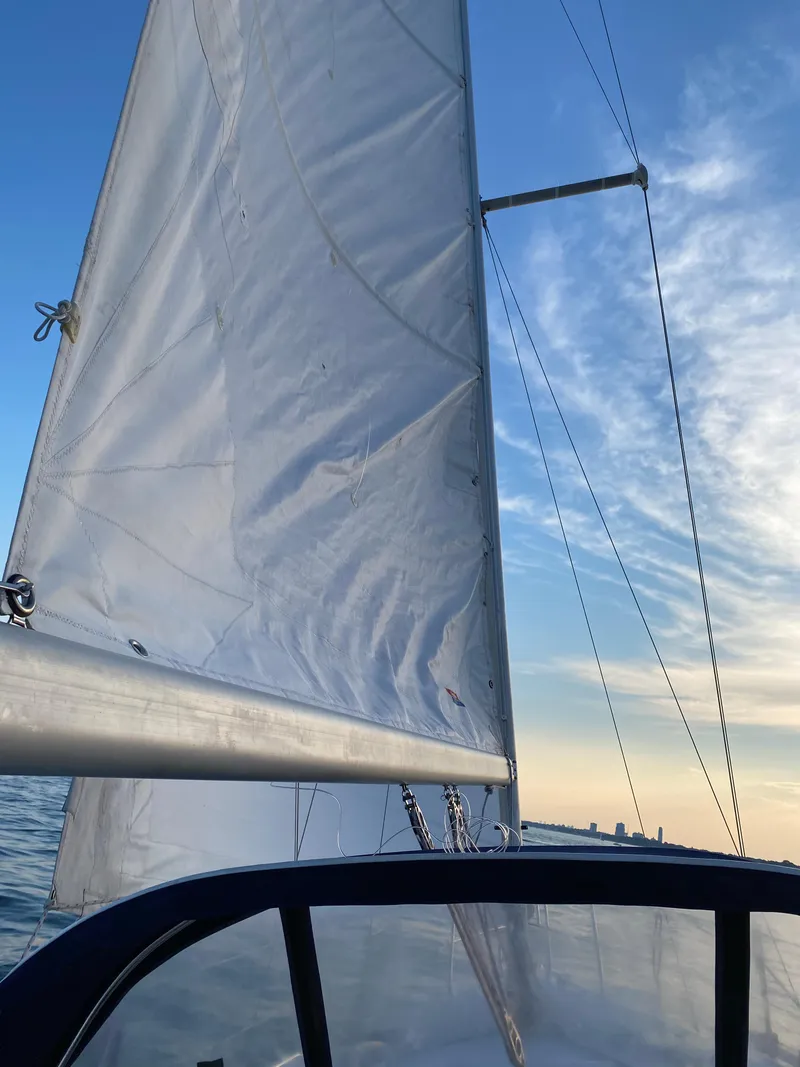 Slide: The Image of Sailing on a 1997 Catalina 28 MkII with white sails against a blue sky. - 6