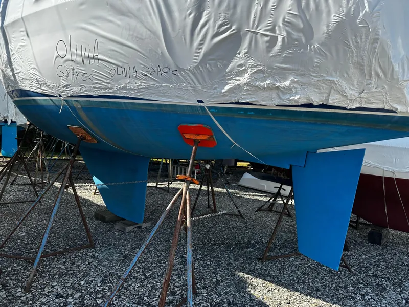 Slide: The Image of Catalina 28 MkII sailboat from 1997, covered and supported on stands. - 7