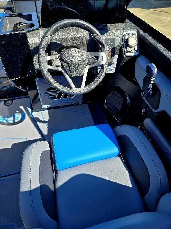 Slide: The Image of 2025 Malibu Wakesetter 25 LSV cockpit with modern steering and controls. - 12