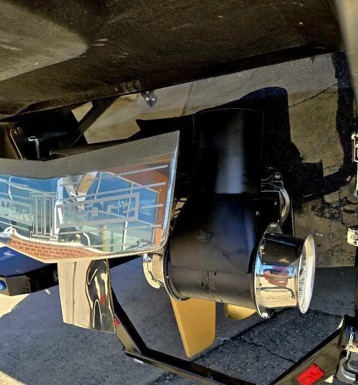 Slide: The Image of 2025 Malibu Wakesetter 25 LSV boat exhaust and propeller detail. - 7