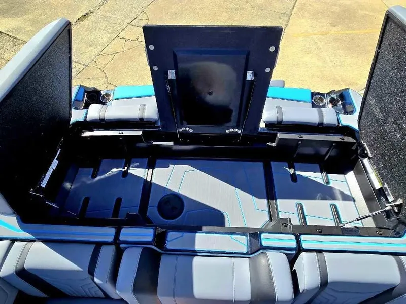 Slide: The Image of 2025 Malibu Wakesetter 25 LSV interior storage compartment, open and spacious. - 8