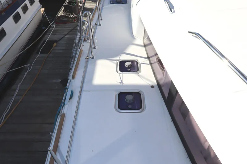 Slide: The Image of 2017 Lagoon 450 F yacht deck with hatches, docked at marina. - 20