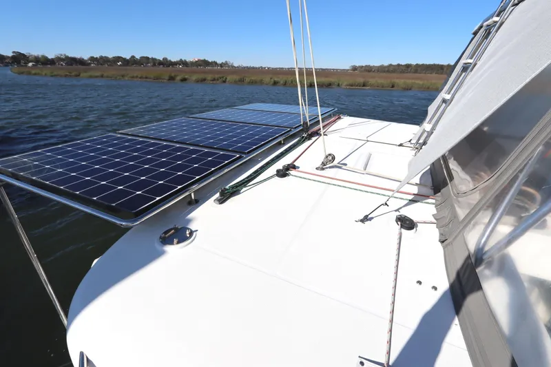 Slide: The Image of 2017 Lagoon 450 F catamaran with solar panels on deck, sailing on a sunny day. - 22