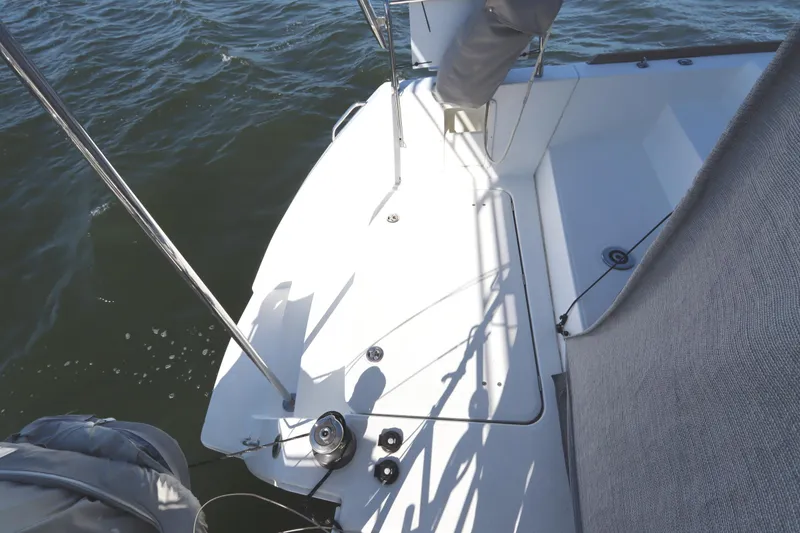 Slide: The Image of 2017 Lagoon 450 F yacht deck with winch, railing, and ocean view. - 23