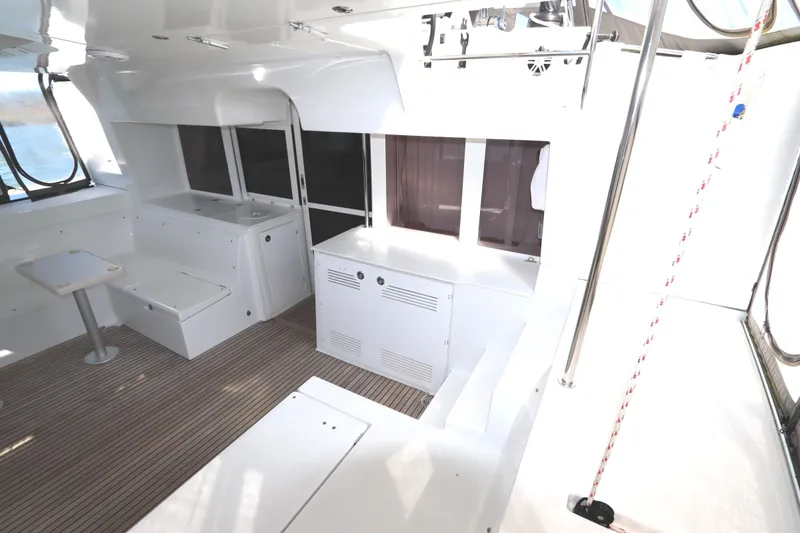 Slide: The Image of Interior of 2017 Lagoon 450 F catamaran with sleek white design and spacious seating area. - 31
