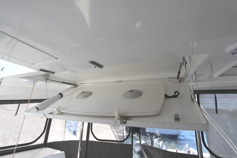 Slide: The Image of Ceiling hatch of 2017 Lagoon 450 F catamaran, open with visible mechanisms. - 34