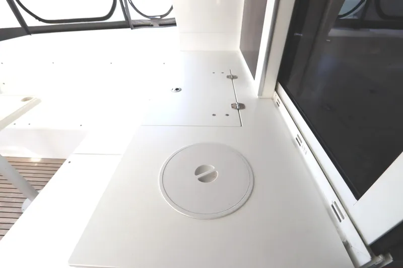 Slide: The Image of 2017 Lagoon 450 F yacht interior with sleek white countertop and modern design. - 38