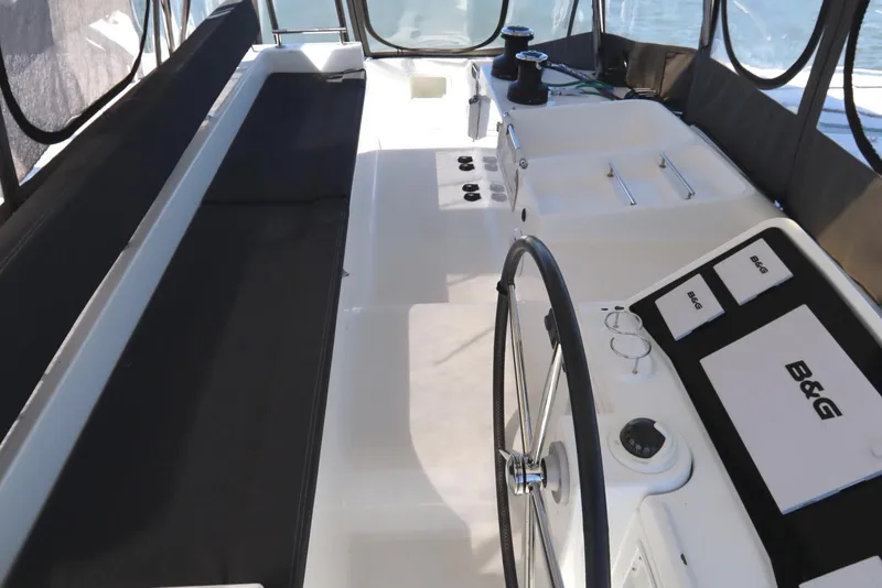 Slide: The Image of Cockpit of 2017 Lagoon 450 F catamaran with steering wheel and navigation equipment. - 46
