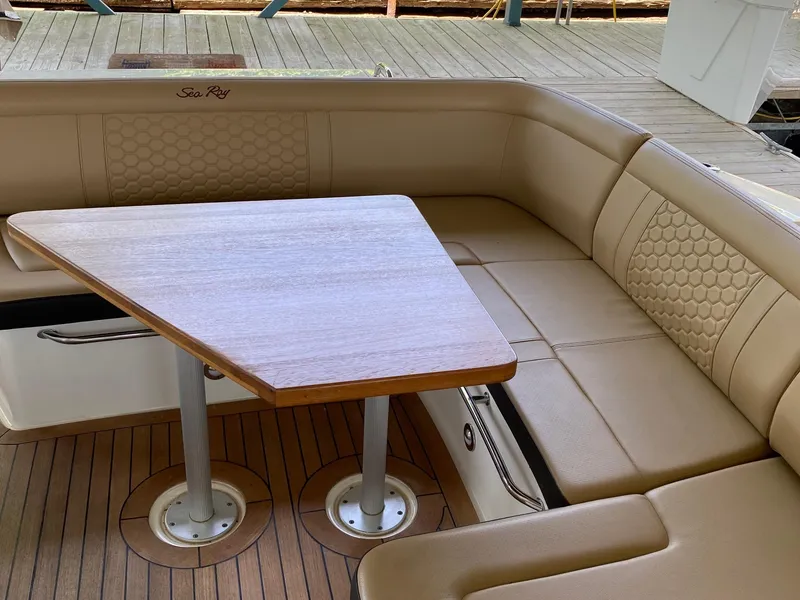 Slide: The Image of Luxurious seating area on 2018 Sea Ray Sundancer 350 yacht with wooden table. - 13