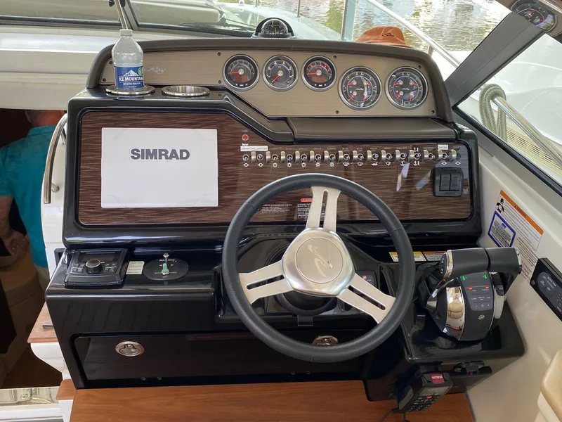 Slide: The Image of 2018 Sea Ray Sundancer 350 helm with Simrad display and controls. - 20