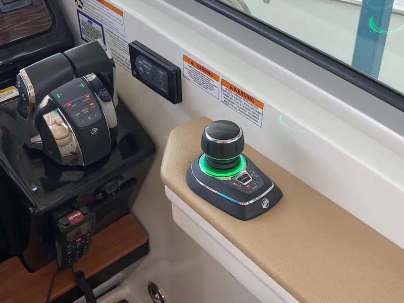 Slide: The Image of Control panel of 2018 Sea Ray Sundancer 350 boat with joystick and throttle. - 21