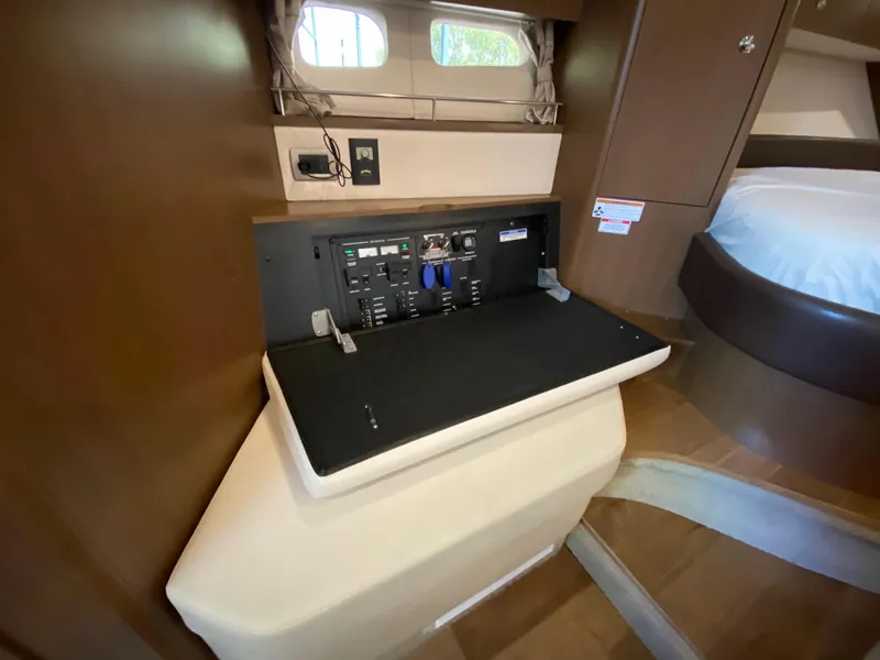 Slide: The Image of Interior of 2018 Sea Ray Sundancer 350 showing control panel and cabin features. - 31