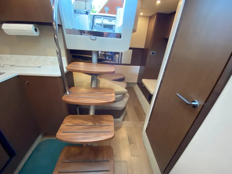Slide: The Image of Interior of 2018 Sea Ray Sundancer 350 yacht with wooden steps and modern design. - 36