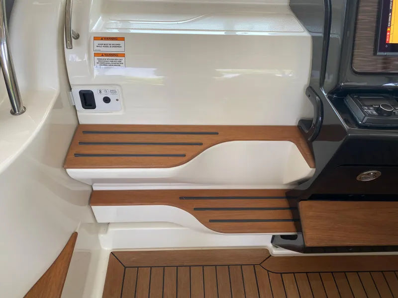Slide: The Image of 2018 Sea Ray Sundancer 350 interior with wooden steps and sleek design. - 44