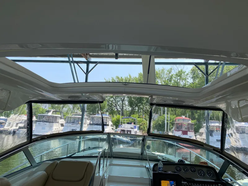 Slide: The Image of Interior view of 2018 Sea Ray Sundancer 350 yacht docked at marina. - 45