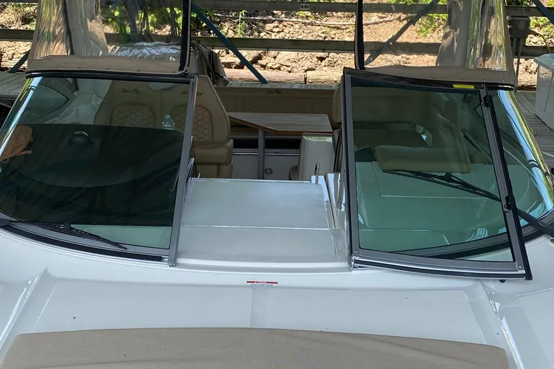 Slide: The Image of 2018 Sea Ray Sundancer 350 boat interior with open windshield and seating area. - 48