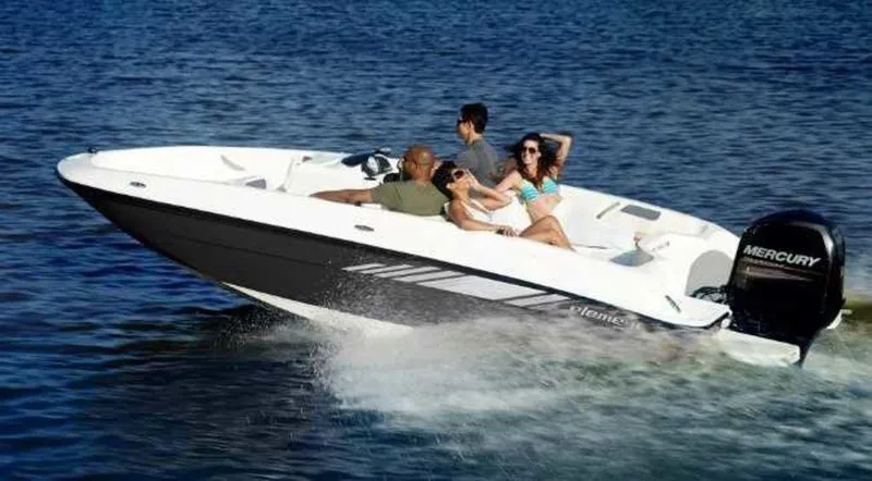 Slide: The Image of 2025 Bayliner E18LE boat cruising on water with passengers enjoying the ride. - 1