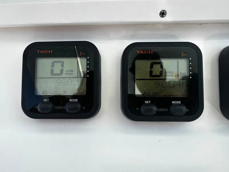 Slide: The Image of Digital tachometers on a 2008 Regulator 29 Forward Seating boat dashboard. - 14