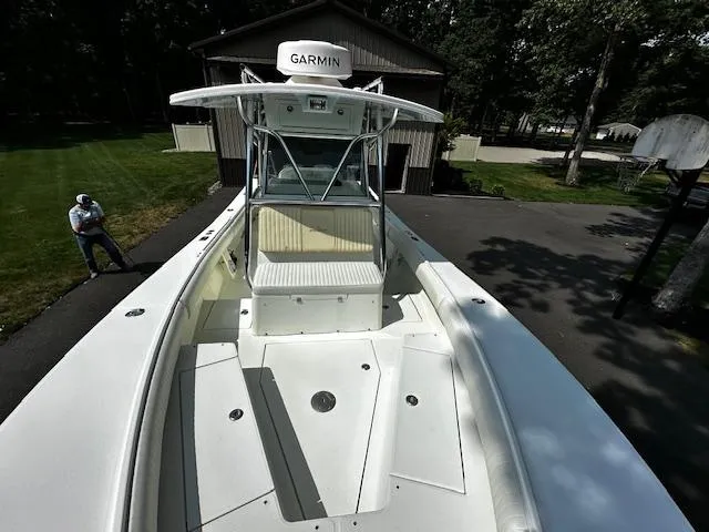 Slide: The Image of 2008 Regulator 29 Forward Seating boat with Garmin equipment, parked outdoors. - 18