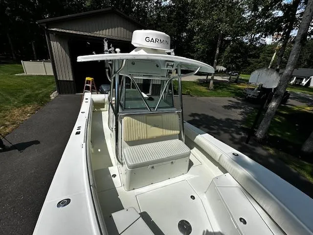 Slide: The Image of 2008 Regulator 29 Forward Seating boat with Garmin equipment, parked near a garage. - 20