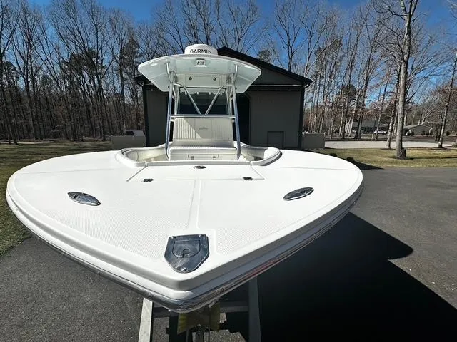 Slide: The Image of 2008 Regulator 29 Forward Seating boat on trailer, parked outdoors. - 3