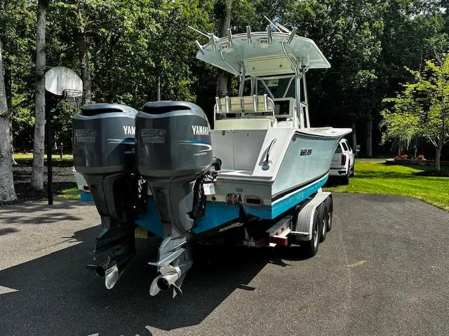 Slide: The Image of 2008 Regulator 29 Forward Seating boat with twin Yamaha engines on a trailer. - 7