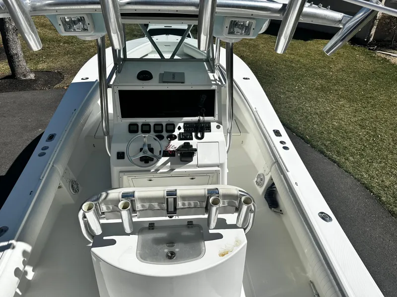 Slide: The Image of 2008 Regulator 29 Forward Seating boat cockpit with steering wheel and control panel. - 9