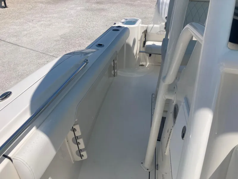 Slide: The Image of 2025 Key West 244CC boat interior, featuring sleek white seating and modern design elements. - 11