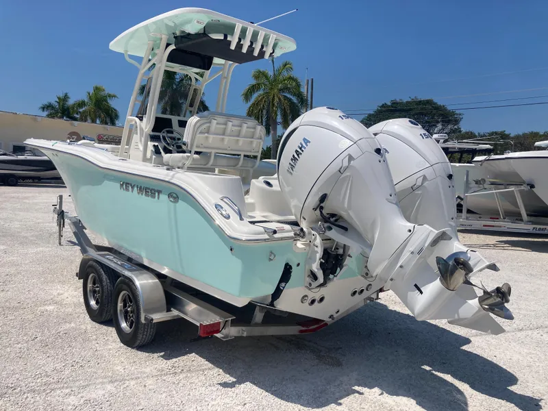Slide: The Image of 2025 Key West 244CC boat with dual Yamaha engines on a trailer. - 3
