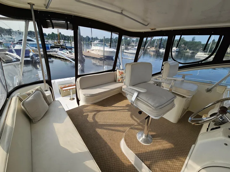 Slide: The Image of Spacious interior of 1998 Ocean Yachts 40, featuring comfortable seating and marina view. - 20