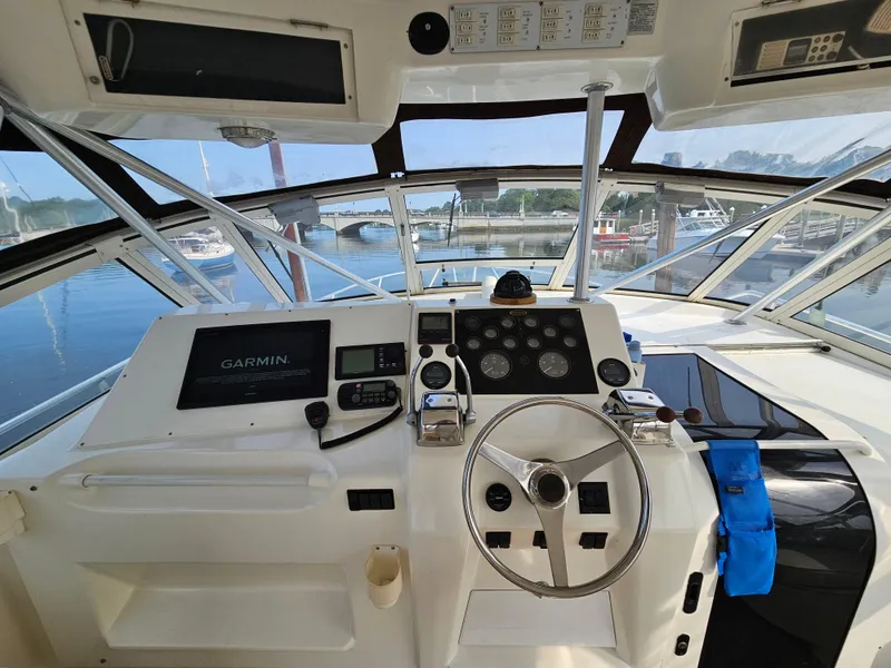 Slide: The Image of Cockpit of 1998 Ocean Yachts 40 with Garmin navigation, docked at marina. - 22
