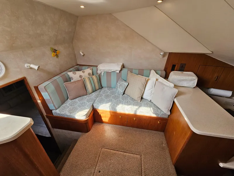Slide: The Image of Cozy interior of 1998 Ocean Yachts 40 with cushioned seating and pillows. - 27