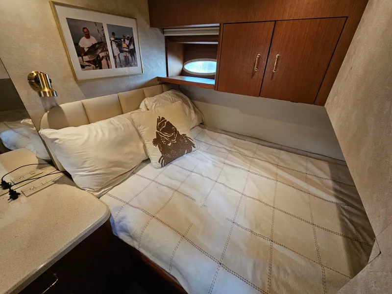 Slide: The Image of Cozy bedroom in 1998 Ocean Yachts 40, featuring a comfortable bed and nautical decor. - 29