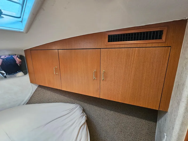 Slide: The Image of Wooden cabinet with three doors in a 1998 Ocean Yachts 40 interior. - 37