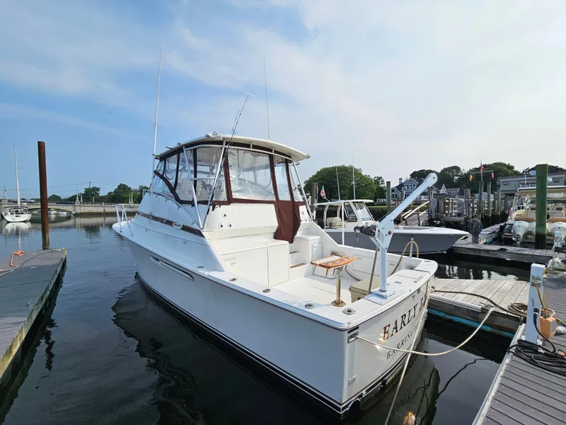 Slide: The Image of 1998 Ocean Yachts 40 docked at marina, clear sky, calm water. - 5