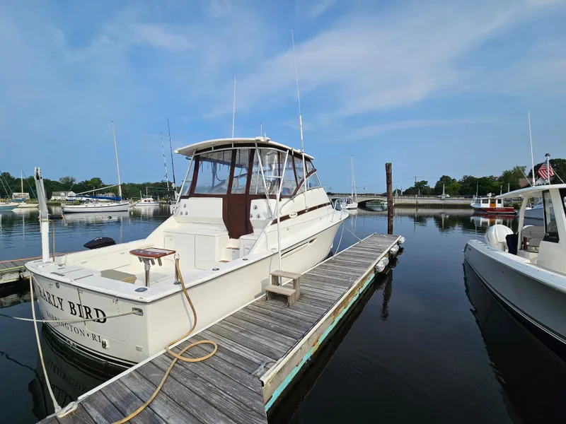 Slide: The Image of 1998 Ocean Yachts 40 docked at marina under clear blue sky. - 8