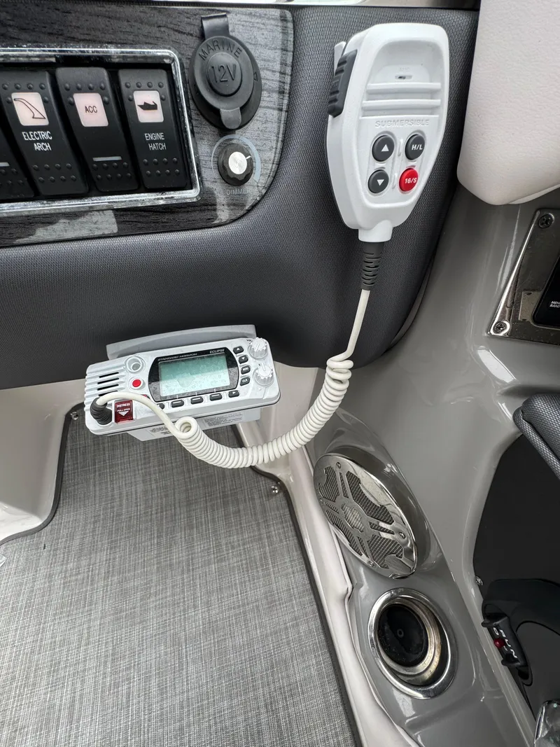 Slide: The Image of Control panel and radio system in a 2019 Chaparral 246 SSi boat interior. - 10