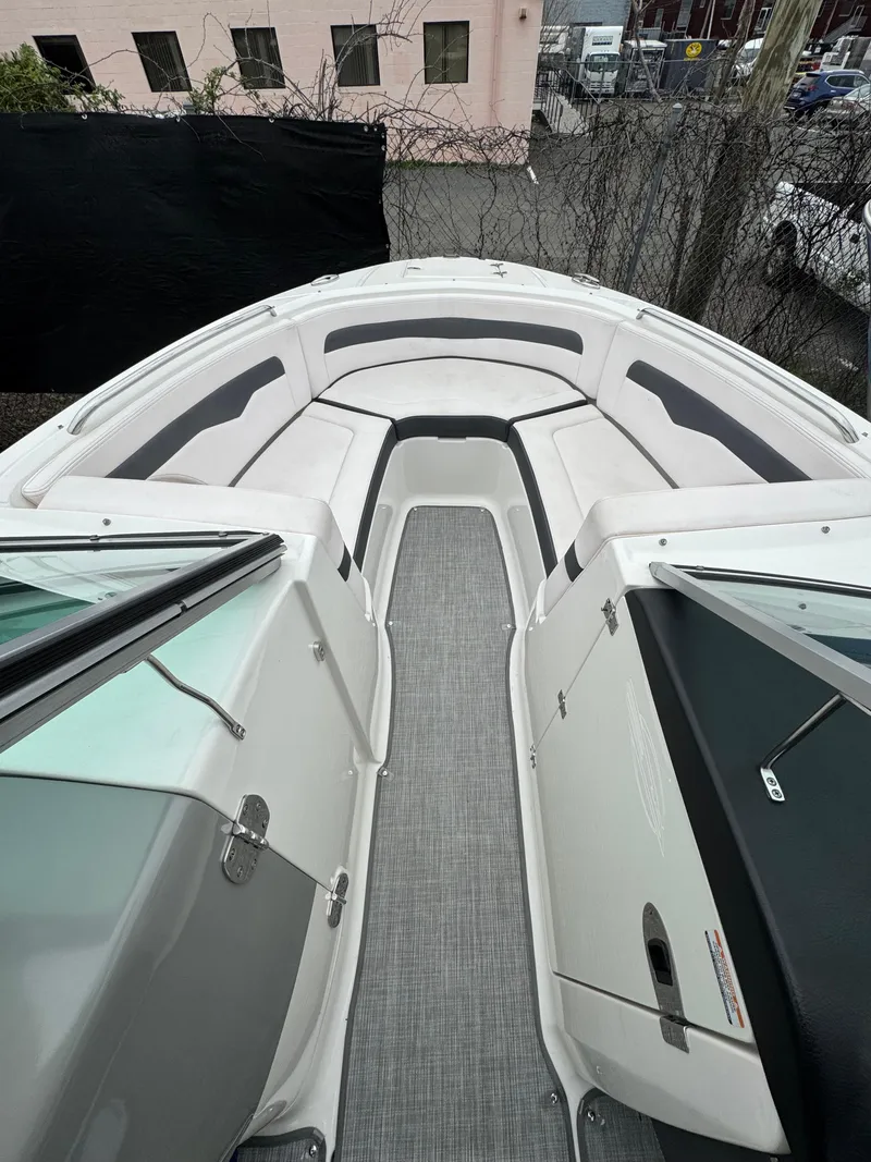 Slide: The Image of 2019 Chaparral 246 SSi boat interior with sleek seating and modern design. - 13