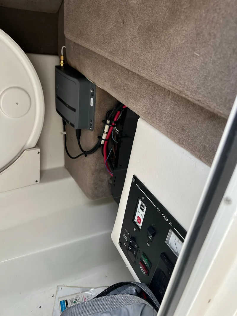 Slide: The Image of 2011 Sea Ray 270 SLX interior showing control panel and wiring setup. - 12