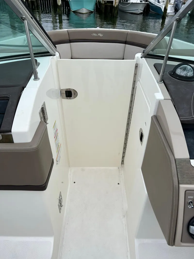 Slide: The Image of 2011 Sea Ray 270 SLX boat interior with seating and control panel. - 14