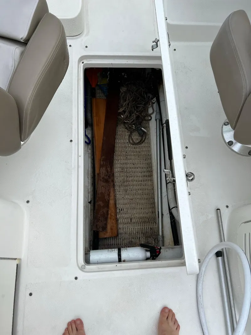 Slide: The Image of Open storage compartment on 2011 Sea Ray 270 SLX boat deck. - 17