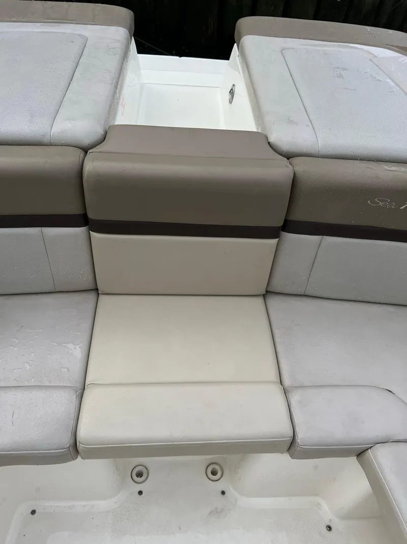 Slide: The Image of 2011 Sea Ray 270 SLX boat seating with beige and gray upholstery. - 20