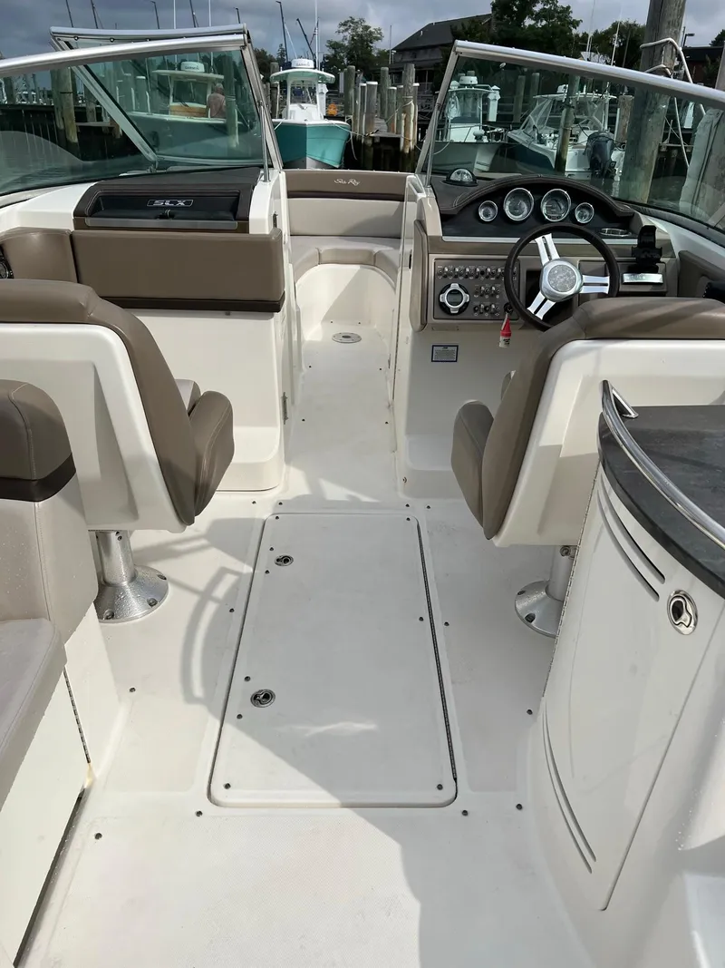 Slide: The Image of 2011 Sea Ray 270 SLX boat interior with dual helm seats and modern dashboard. - 26