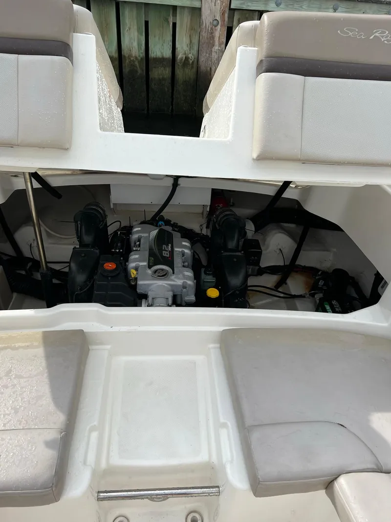 Slide: The Image of 2011 Sea Ray 270 SLX boat engine compartment with visible engine components. - 33