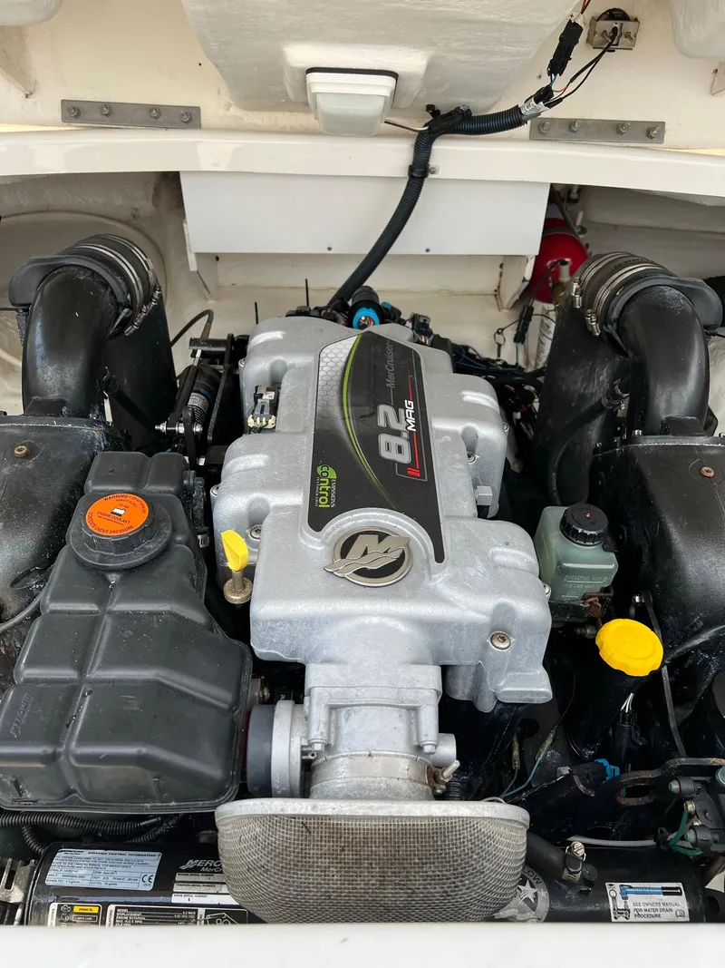 Slide: The Image of 2011 Sea Ray 270 SLX engine compartment showcasing a powerful 8.2L motor. - 34