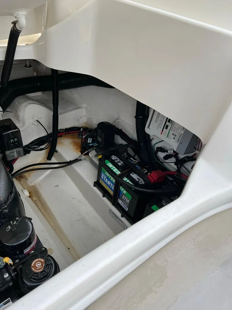 Slide: The Image of Engine compartment of a 2011 Sea Ray 270 SLX boat, showing batteries and wiring. - 35