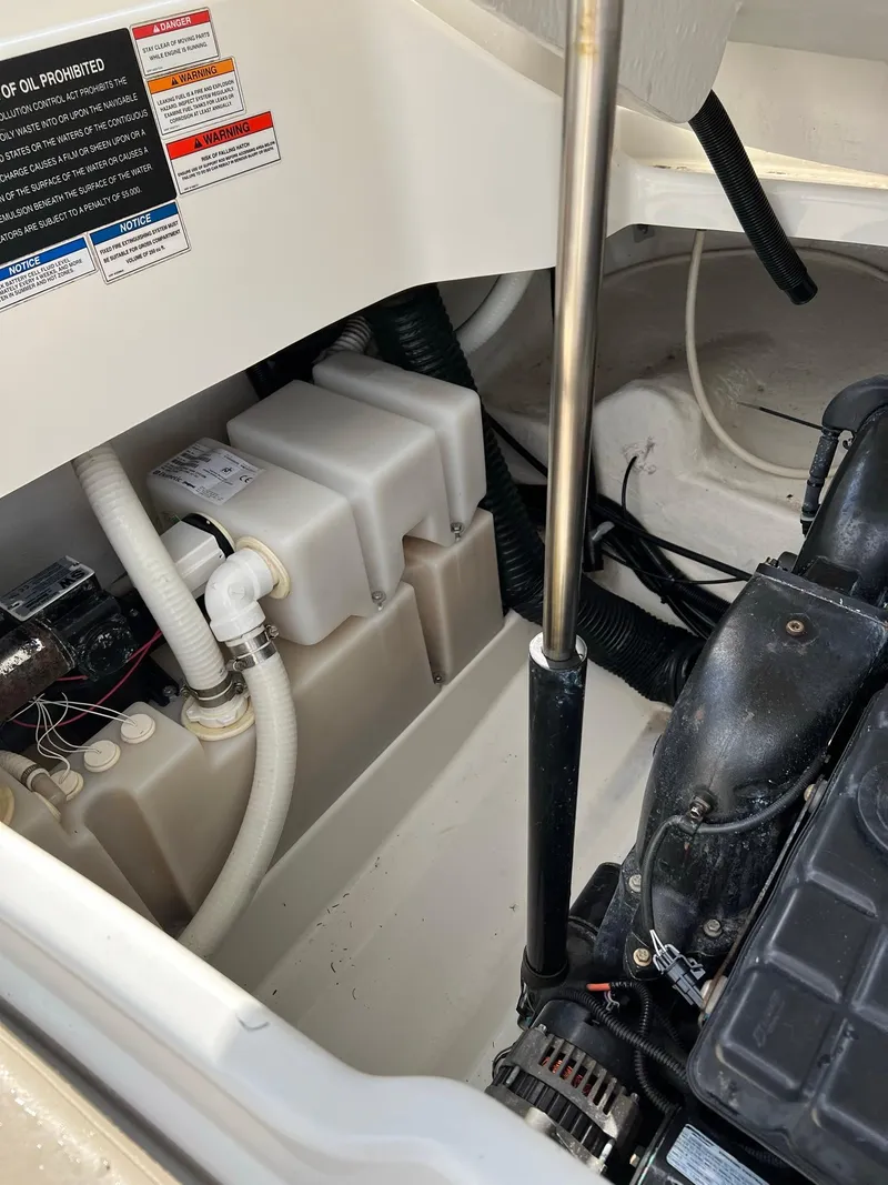 Slide: The Image of Engine compartment of a 2011 Sea Ray 270 SLX boat, showing mechanical components and wiring. - 36