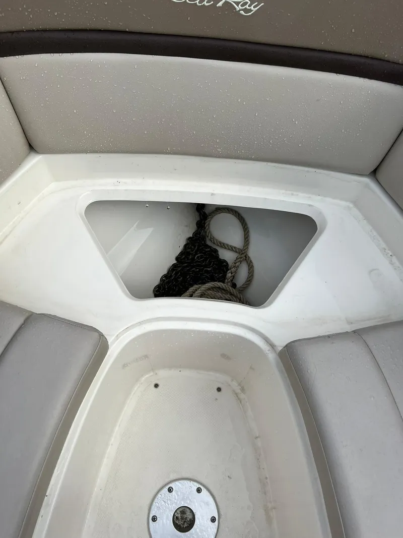 Slide: The Image of 2011 Sea Ray 270 SLX boat storage compartment with ropes. - 7