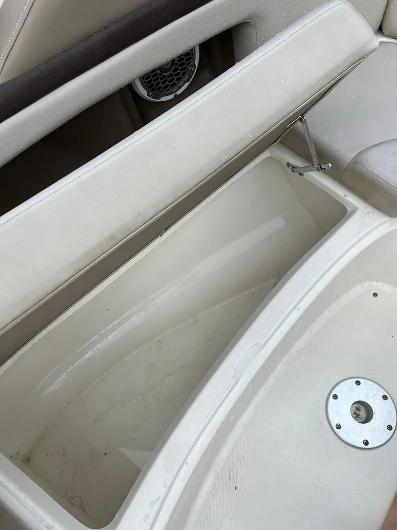 Slide: The Image of Open storage compartment on 2011 Sea Ray 270 SLX boat, featuring white interior. - 9